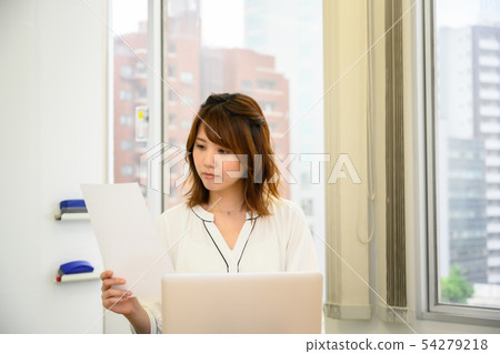 Young woman checking documents 54279218