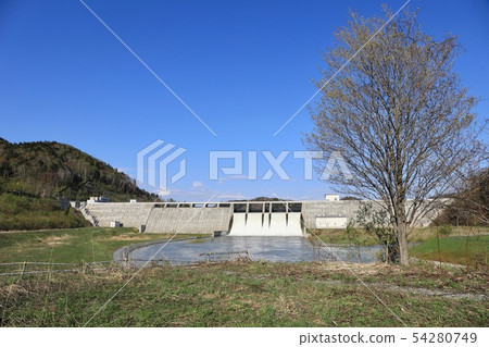 Spring's Tobetsu dam in a large flood of water Spring's Tobetsu dam in a large flood of water 54280749