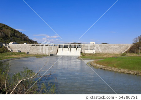 Spring's Tobetsu dam in a large flood of water 54280751