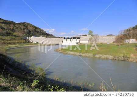 Spring's Tobetsu dam in a large flood of water 54280756
