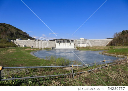 Spring's Tobetsu dam in a large flood of water 54280757