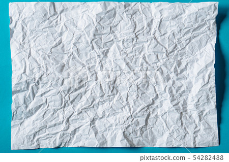 White crumpled paper on blue background White crumpled paper on blue background 54282488