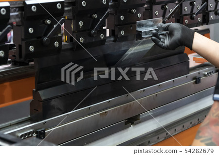 The sheet metal bending machine. 54282679