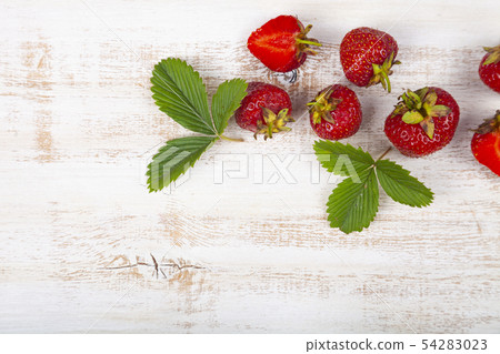 Ripe strawberries on a table. Ripe strawberries on a table. 54283023