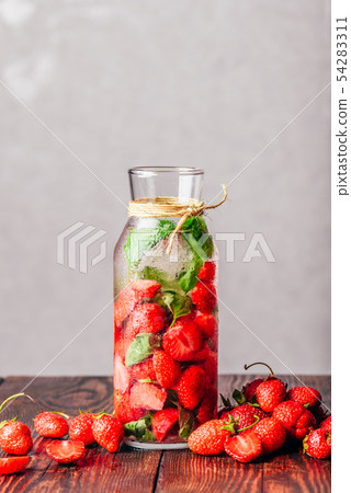 Infused Water with Strawberry and Basil. 54283311