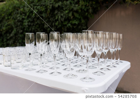 Many empty clean glasses for guests at the buffet Many empty clean glasses for guests at the buffet 54285708
