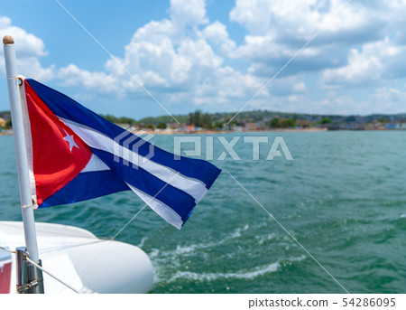 Cuba flag waving on boat at sea near Cuban 54286095