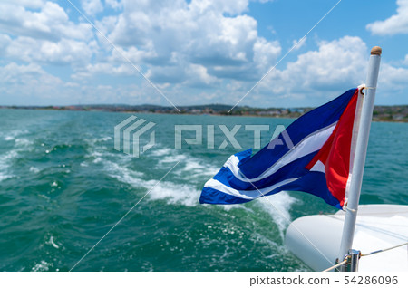 Cuba flag waving on boat at sea near Cuban 54286096