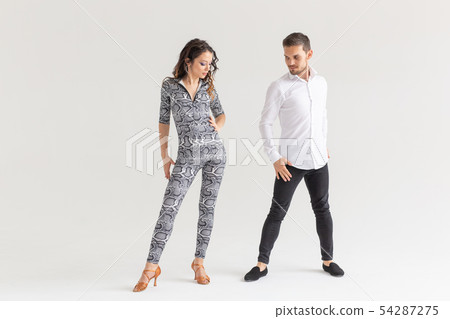 Salsa, kizomba and bachata dancers on white background with copy space. Social dance concept 54287275