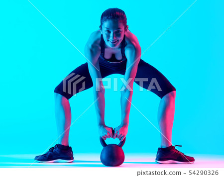 woman exercsing Kettle Bell fitness exercices woman exercsing Kettle Bell fitness exercices 54290326