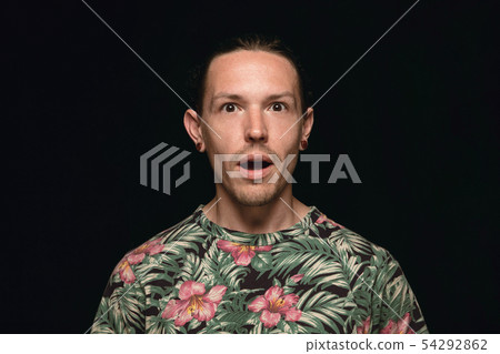 Close up portrait of young man isolated on black studio background 54292862