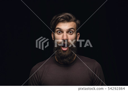 Close up portrait of young man isolated on black studio background Close up portrait of young man isolated on black studio background 54292864