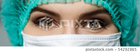 Female doctor's face wearing protective mask Female doctor's face wearing protective mask 54292865