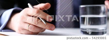Arm fill and sign important form clipped to pad with silver pen 54293001