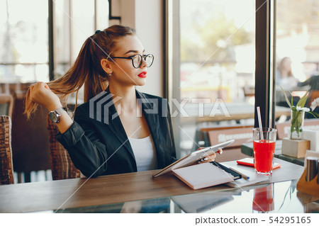 Businesswoman sitting in a cafe 54295165