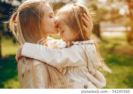 elegant mother with cute daughter 54295560