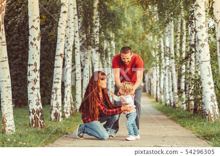family with children in birch grove family with children in birch grove 54296305