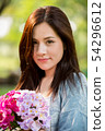 closeup beautiful asian woman with flower 54296612