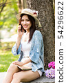 front view of concentrated beautiful asian woman 54296622
