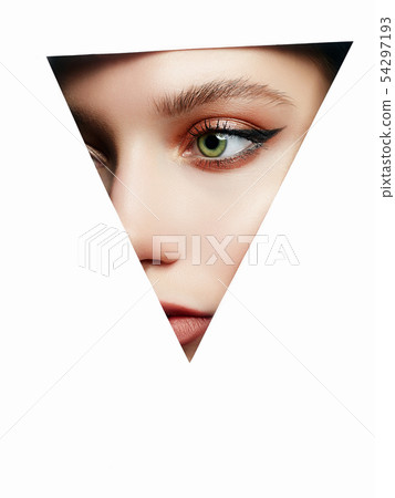 beautiful woman with makeup into paper hole beautiful woman with makeup into paper hole 54297193