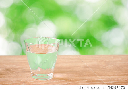 Nature background with glass of water on the table 54297470