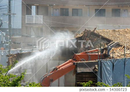 Demolition site of a dusty building 54300723