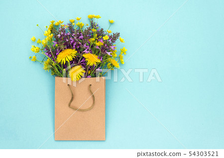 Field colorful rustic flowers in craft package on 54303521