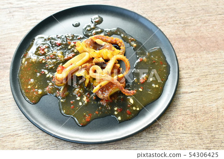 grilled squid dressing spicy sauce on plate grilled squid dressing spicy sauce on plate 54306425