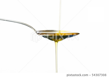 olive oil on spoon in white background olive oil on spoon in white background 54307308