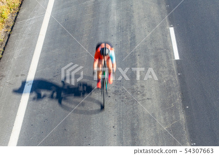 Cyclist Road Race Motion Speed Blur Overhead Cyclist Road Race Motion Speed Blur Overhead 54307663