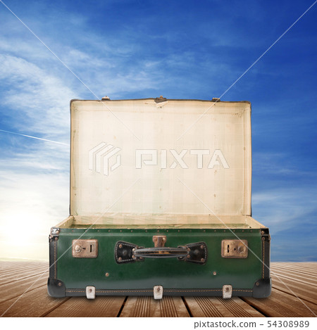 vintage suitcase on sky background vintage suitcase on sky background 54308989