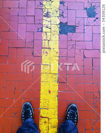 standing on a tiles floor standing on a tiles floor 54309126