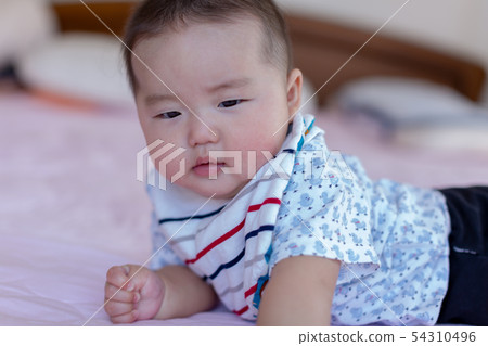 A lying baby 54310496