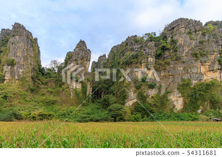 Beautiful limestome mountain range at Ban Mung Beautiful limestome mountain range at Ban Mung 54311681