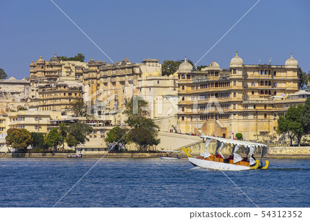 Boat travel in lake Pichola. 54312352