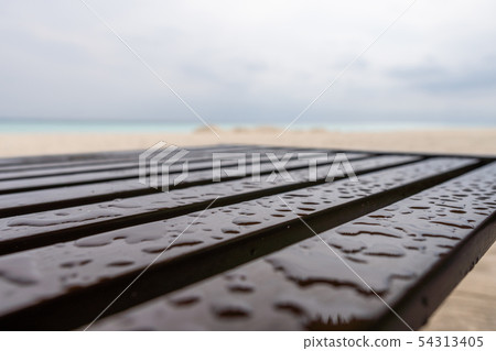 Chair on the beach after a rain Chair on the beach after a rain 54313405