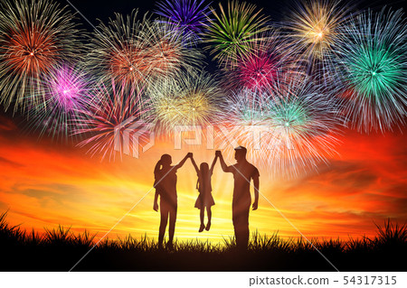 happy family standing and watching the fireworks happy family standing and watching the fireworks 54317315