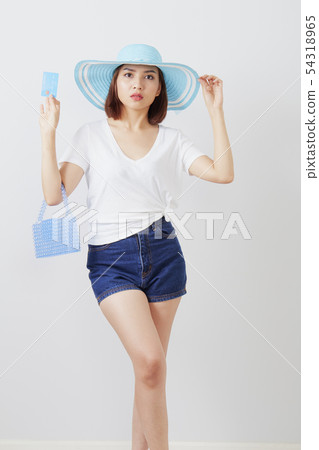 Woman in hat hand holding card 54318965
