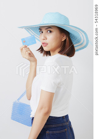 Woman in hat hand holding card Woman in hat hand holding card 54318969