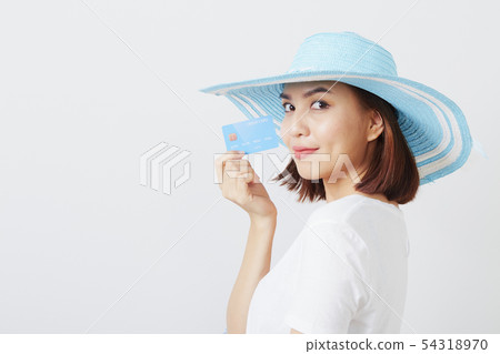 Woman in hat hand holding card 54318970