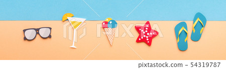 Summer beach accessories laying on sand near the sea 54319787