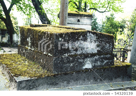 Tombstones in cemetery at dusk, gothic style crosses Paris Tombstones in cemetery at dusk, gothic style crosses Paris 54320139