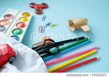 Backpack with different colorful stationery on tab 54320875