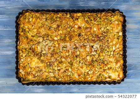 Apple tart with pumpkin seeds. Apple tart with pumpkin seeds. 54322077