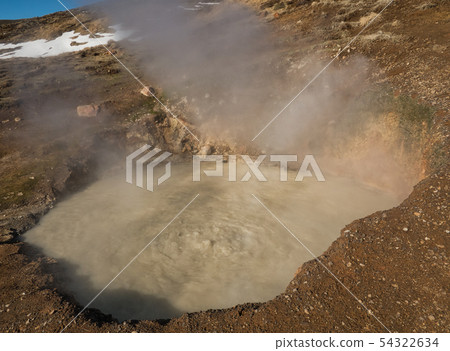 Steaming and boiling mud basin in Iceland 54322634