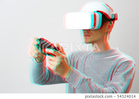 Man with virtual reality headset is playing game. Image with glitch effect. Man with virtual reality headset is playing game. Image with glitch effect. 54324014