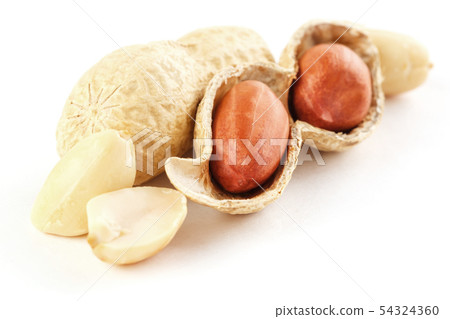 Peanuts closeup in shell and peeled on a white 54324360