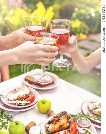 People drink rose and white wine. Dinner People drink rose and white wine. Dinner 54326253