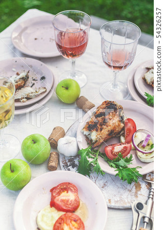 Glasses of white and rose wine, grilled fish Glasses of white and rose wine, grilled fish 54326257
