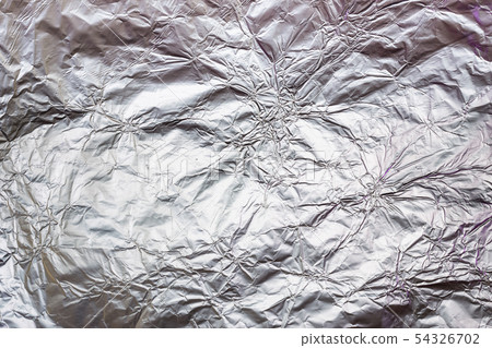 Crumpled aluminum foil background or texture. Wavy 54326702